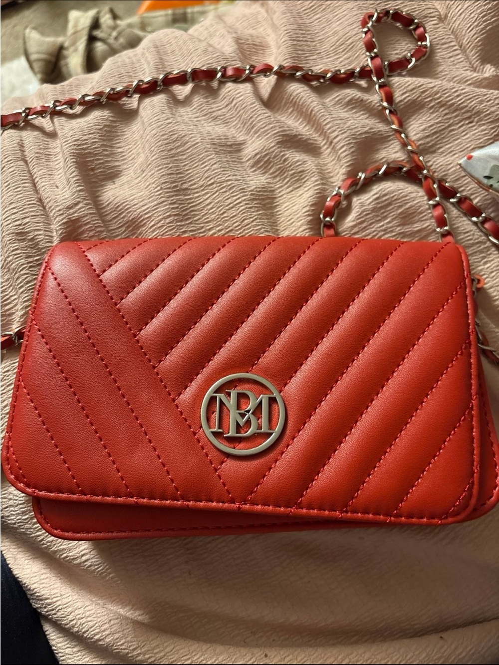 Quilted Red Crossbody Bag with Chain Strap and Round Logo Accent